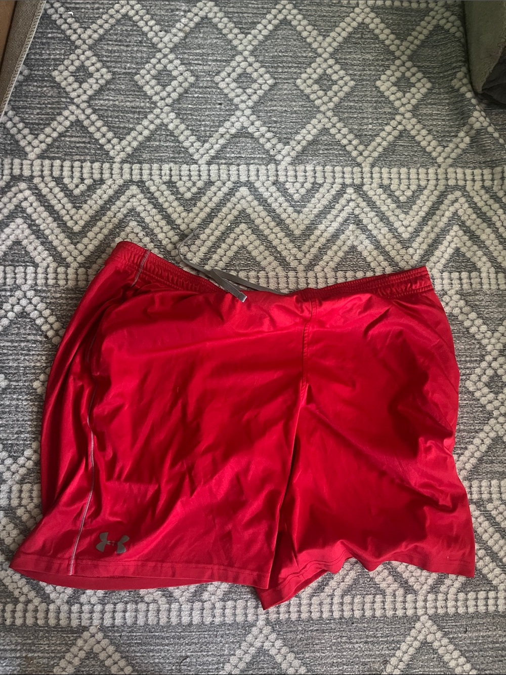 UA mens red basketball style workout shorts